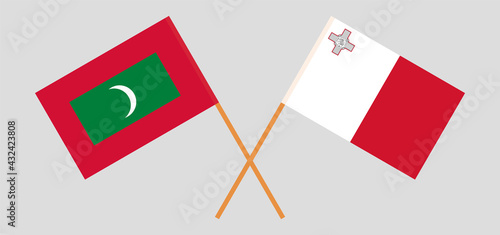 Crossed flags of Maldives and Malta. Official colors. Correct proportion
