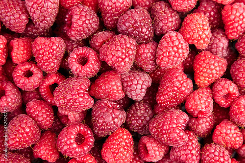 Raspberry food background, top view. Red sweet raspberries
