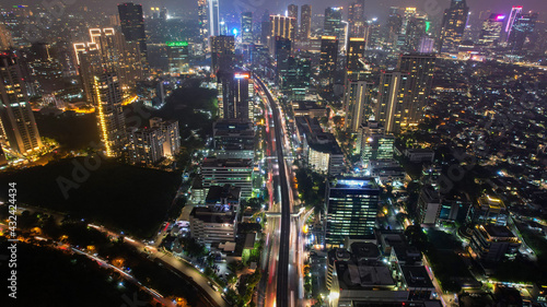 Wallpaper Mural Aerial view of highway intersection and buildings in the city of Jakarta at night and noise cloud with Jakarta cityscape. Jakarta, Indonesia, May 8, 2021 Torontodigital.ca