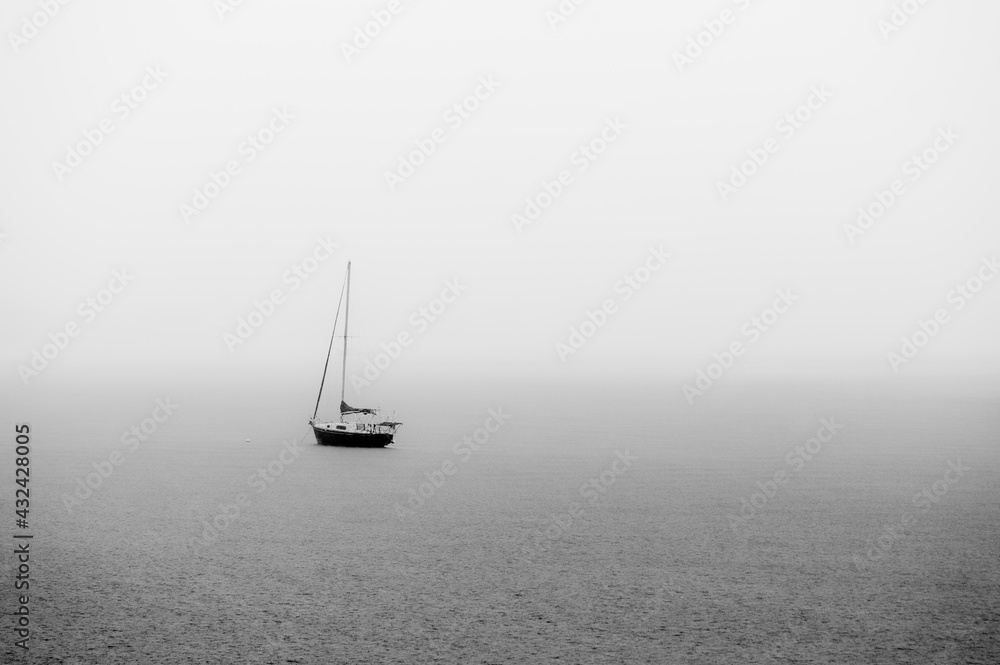 sailboat on the rainy sea Black and White