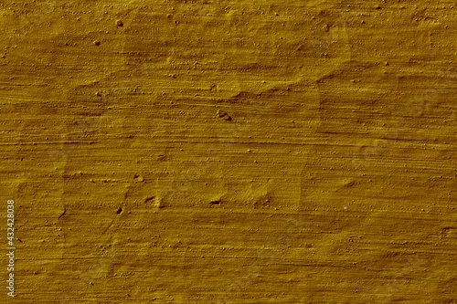 Texture of the lemon yellow stucco wall with scratches, cracks, dust, crevices, roughness. Can be used as a poster or background for design.