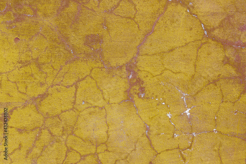 Texture of the lemon yellow stucco wall with scratches, cracks, dust, crevices, roughness. Can be used as a poster or background for design. © INTHEBLVCK