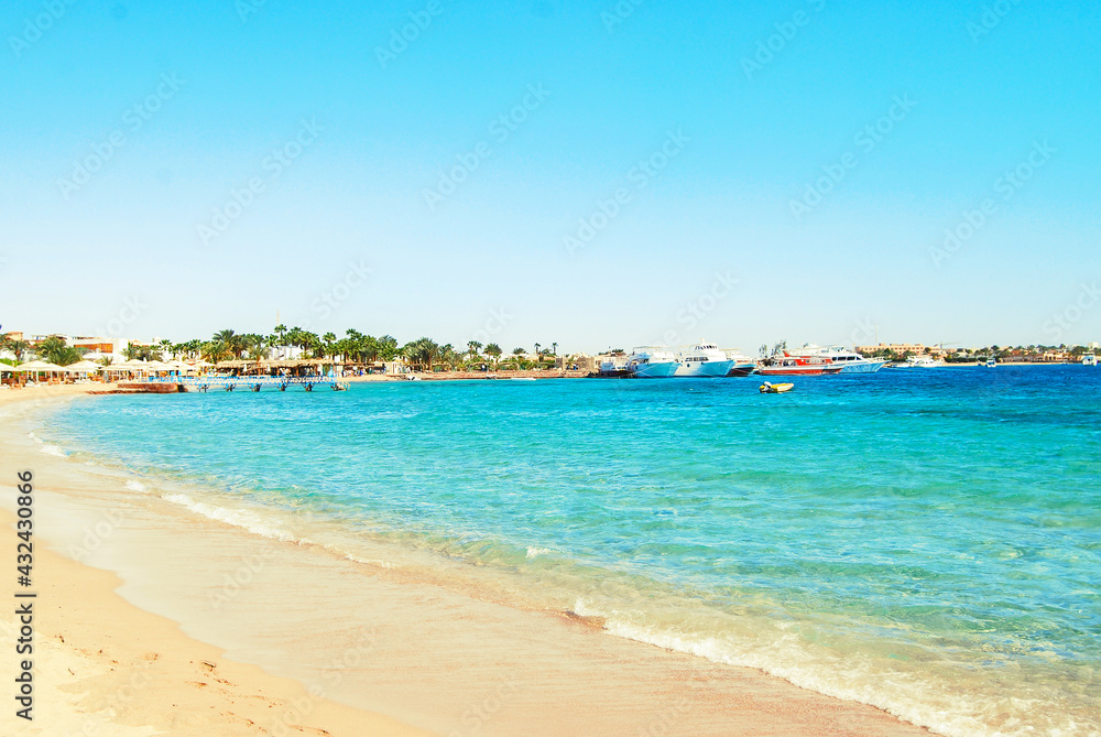 Egypt, Safaga, Red Sea coast, waves, blue lagoon, white sand, sunny day, vacation by the sea.