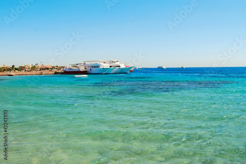 Egypt, Safaga, Red Sea coast, waves, blue lagoon, white sand, sunny day, vacation by the sea.