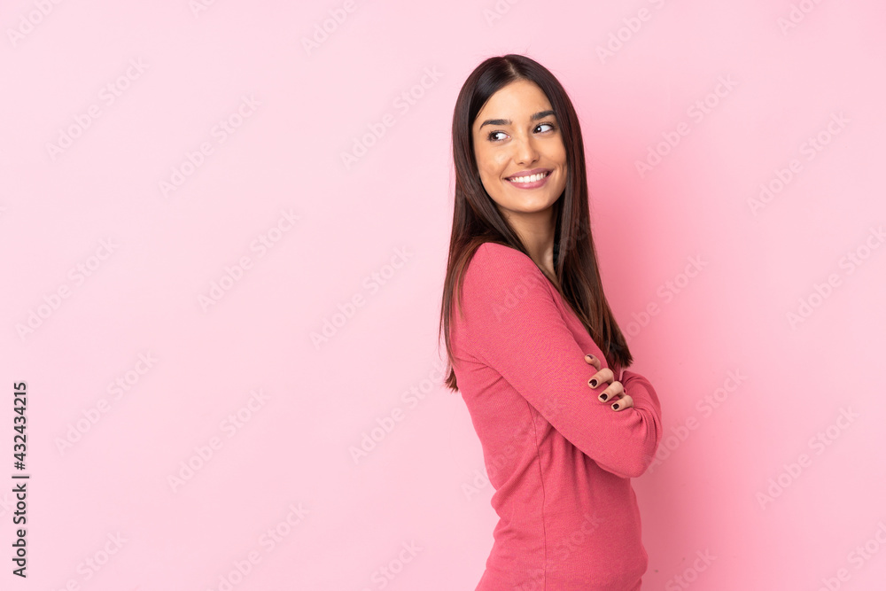 Young caucasian woman over isolated background with arms crossed and happy Young caucasian woman over isolated background with arms crossed and happy