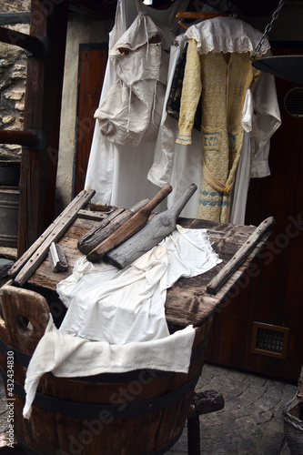 Foto Antique wood bucket and wooden washer for laundry