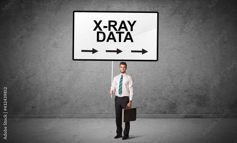 business person holding a traffic sign