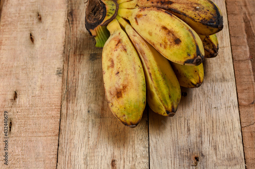 Fresh Banana fruit /pisang kepok/saba banana/cardaba bali/nipah banan on wooden background  photo