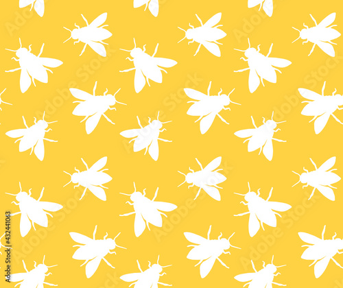 Vector seamless pattern of white hand drawn bee silhouette isolated on yellow background
