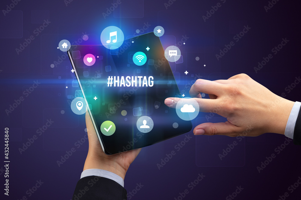 Businessman holding a foldable smartphone concept Businessman holding a foldable smartphone concept