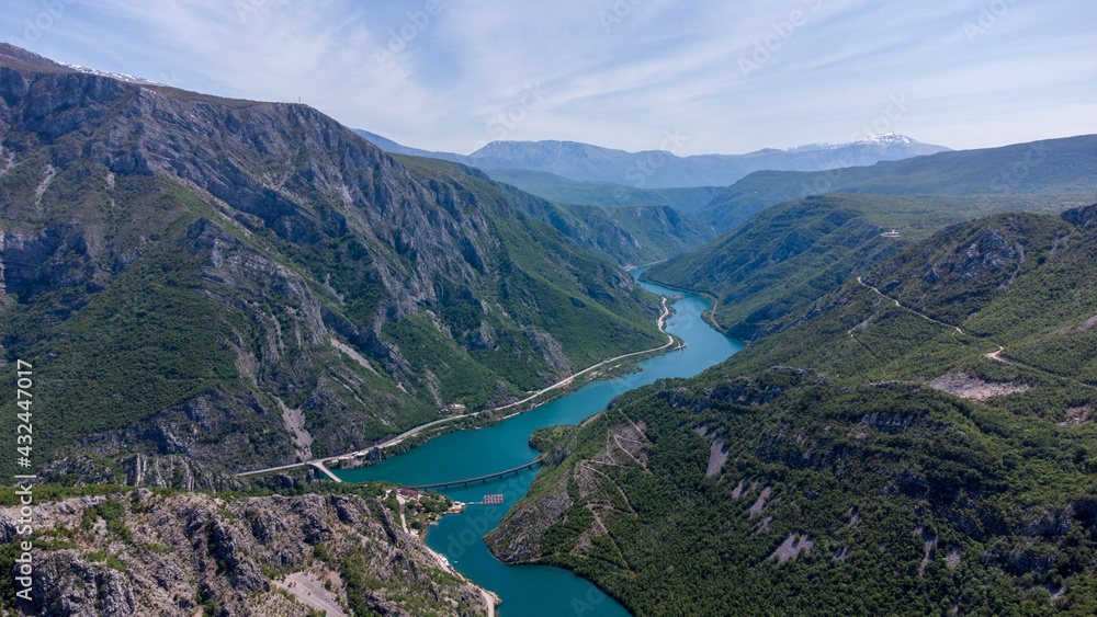 Aerial drone view of canyon and river in early spring. Flying above mountains. Landscape in nature. Bosnia and Herzegovina. Aerial drone view of canyon and river in early spring. Flying above mountains. Landscape in nature. Bosnia and Herzegovina.