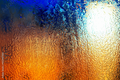 Texture of the ice on the glass . Winter background . icy gradient texture