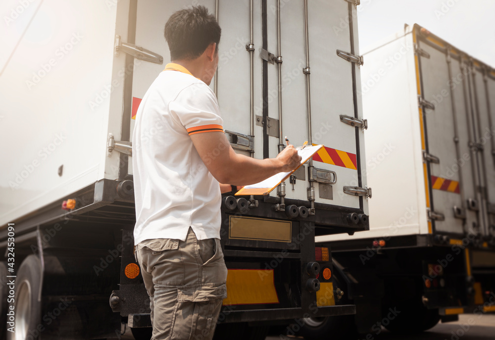 Asian A Truck Driver Holding Clipboard Inspecting Shipping Container Door. Truck inspection Safety Maintenance. Industry Freight Truck Transportation.	