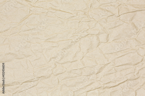 crumpled light brown recycled wrap paper textured background