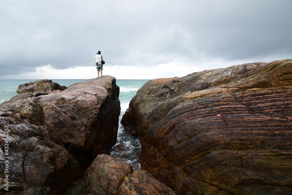 Obraz premium Seaside rocks on Khao Na Yak beach, a beautiful tourist attraction in Ban Tha Din Daeng community