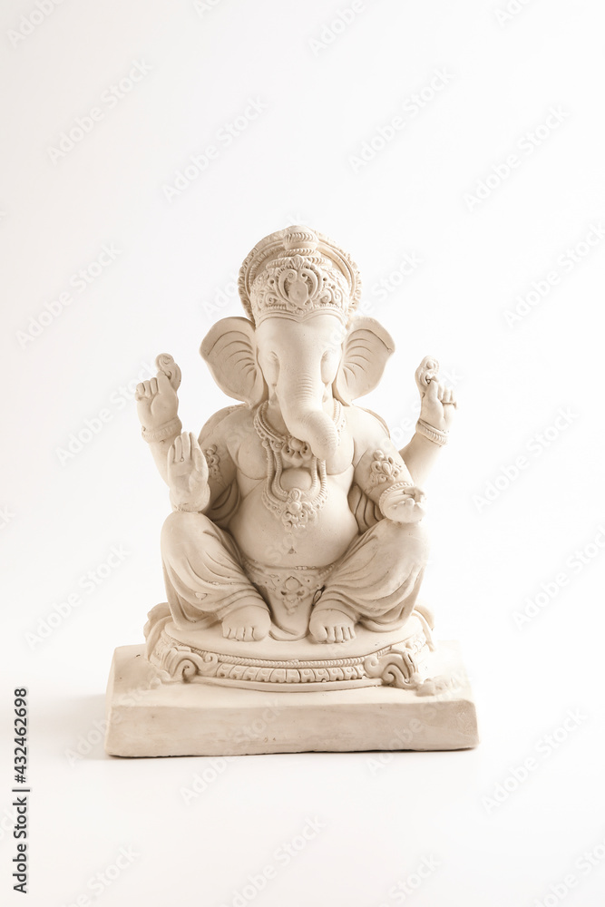 Statue of Lord Ganesha Made from plaster of Paris without color on white background.