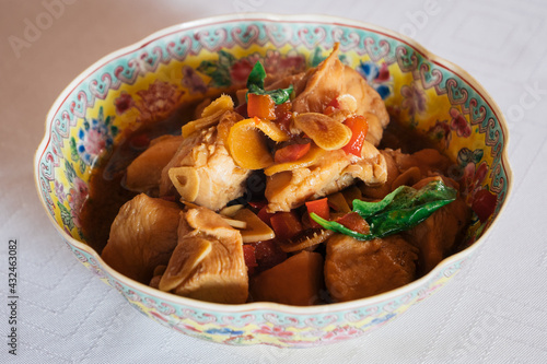 San Bei Ji Three Cup Chicken in a Traditional Chinese Bowl, a Traditional Dish of the Taiwanese Cuisine photo