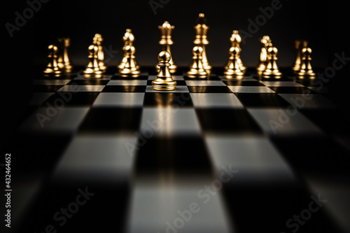Chess in front of the row with king and bishop teamwork on chess board concepts of business team and leadership strategy and organization risk management.