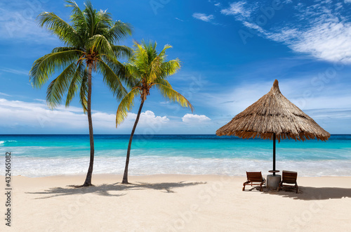 Paradise Sunny beach in Caribbean island. Fashion travel and tropical beach concept. © lucky-photo