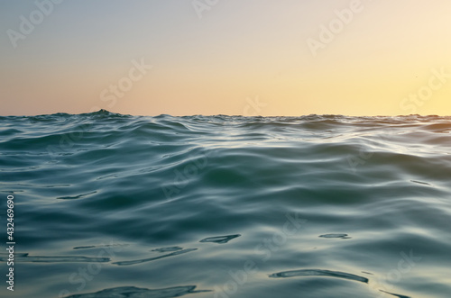 Sea waves on sunset. © GIS