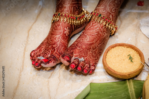 Photography A photo of an South Indian bride showing the toe right during the wedding ceremony
