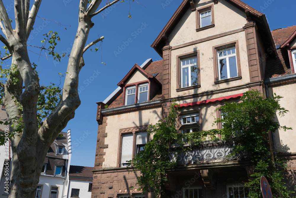 Karlsruhe, Germany - Sept. 11, 2020: closeup of an old historic building with a scenic balcony and a leafy facade
