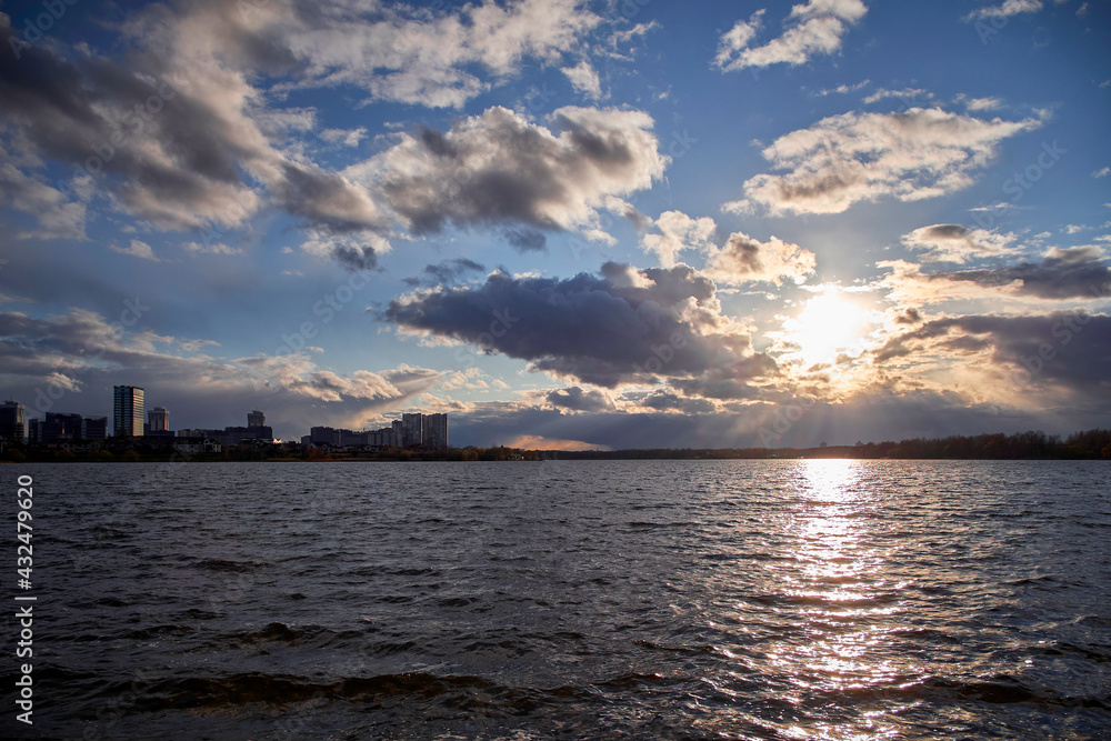 MINSK, REPUBLIC OF BELARUS - 04.25.2021: sunset over a reservoir in the city.