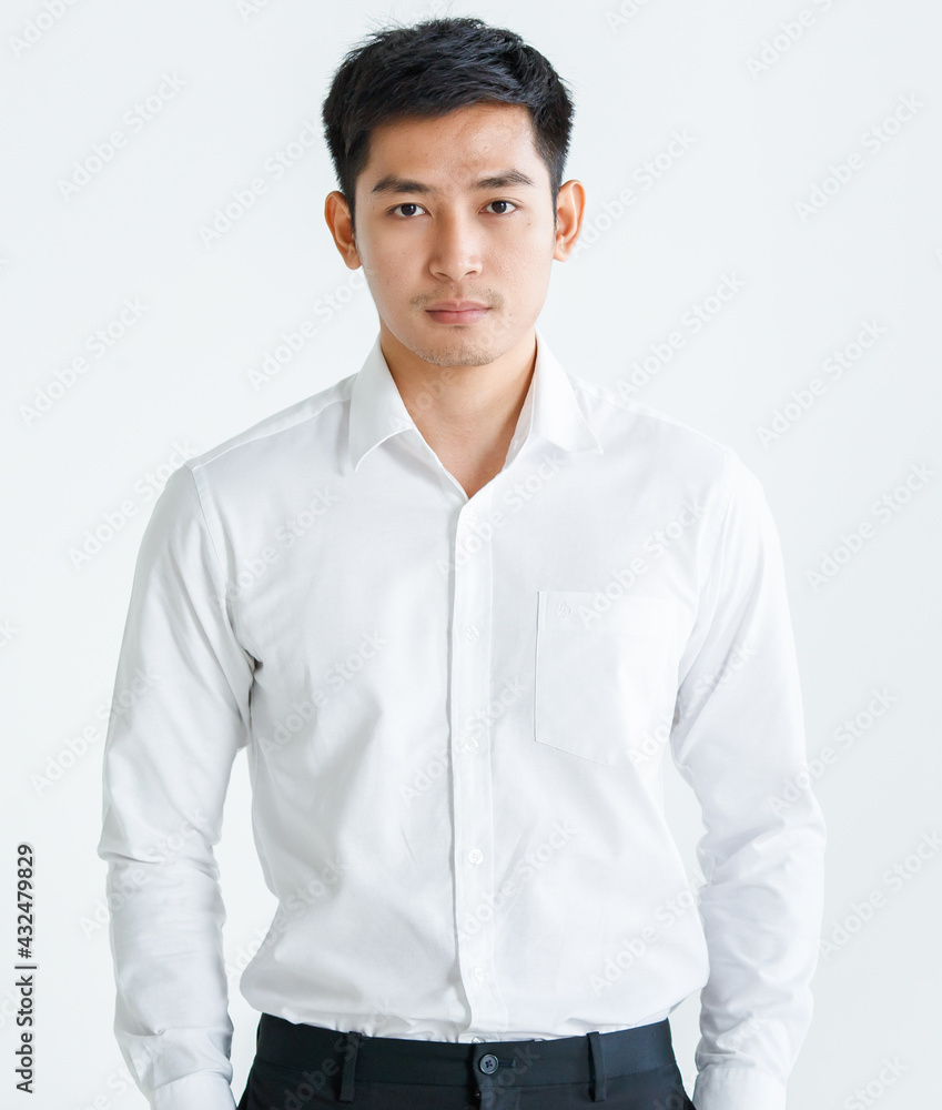 Confident male Asian entrepreneur looking at camera Confident male Asian entrepreneur looking at camera