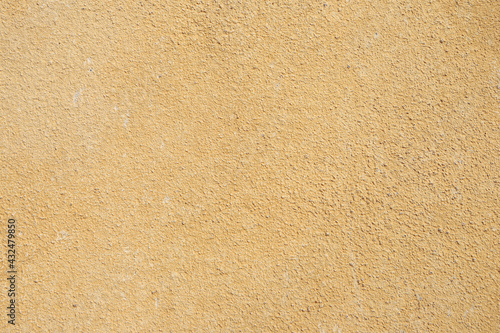 Old yellow cement plaster wall texture background
