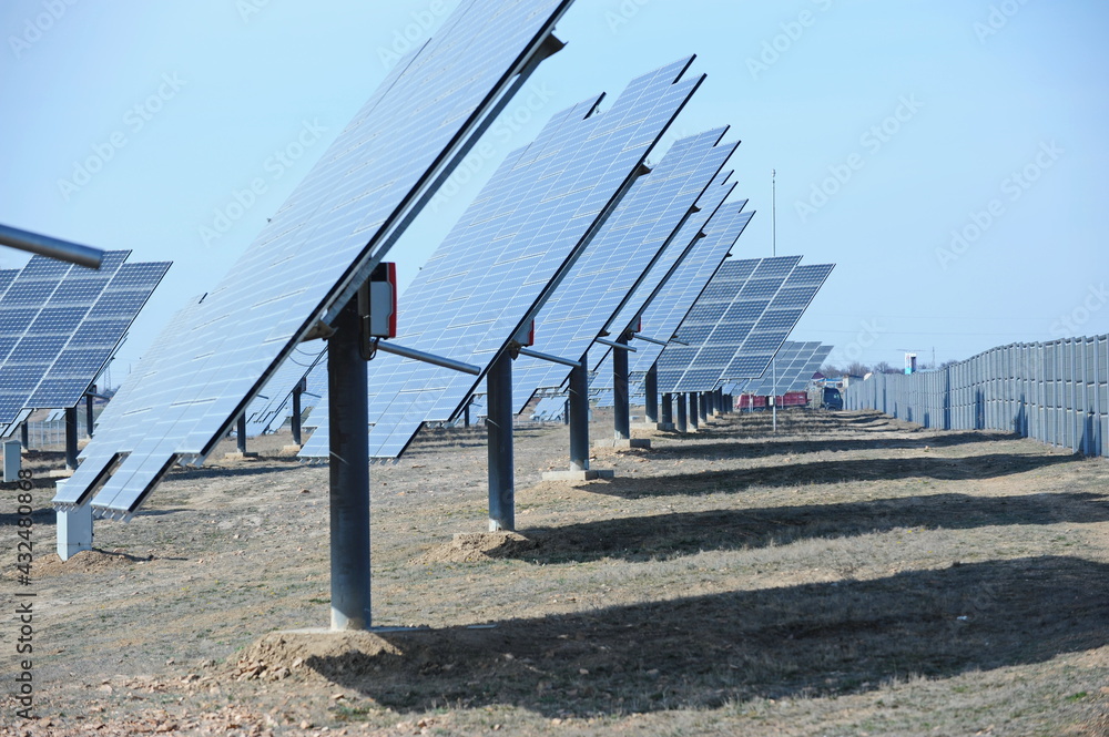 Almaty, Kazakhstan - 03.11.2016 : Solar panels of different sizes are lined up in a row to collect energy. Almaty, Kazakhstan - 03.11.2016 : Solar panels of different sizes are lined up in a row to collect energy.