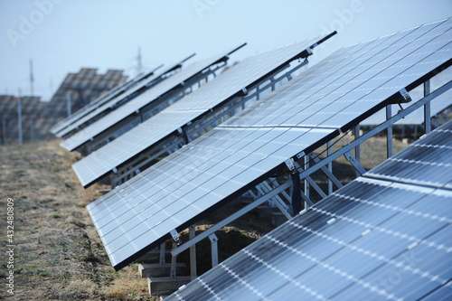 Almaty, Kazakhstan - 03.11.2016 : Solar panels of different sizes are lined up in a row to collect energy. photo