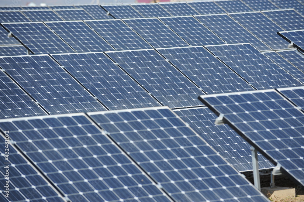 Almaty, Kazakhstan - 03.11.2016 : Solar panels of different sizes are lined up in a row to collect energy. Almaty, Kazakhstan - 03.11.2016 : Solar panels of different sizes are lined up in a row to collect energy.