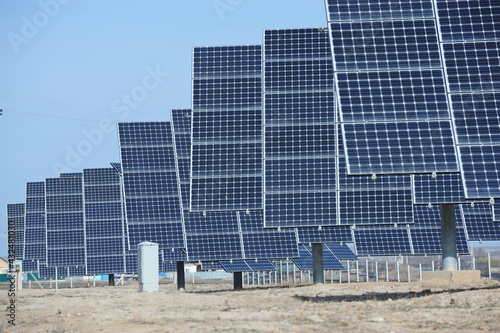 Almaty, Kazakhstan - 03.11.2016 : Solar panels of different sizes are lined up in a row to collect energy. photo