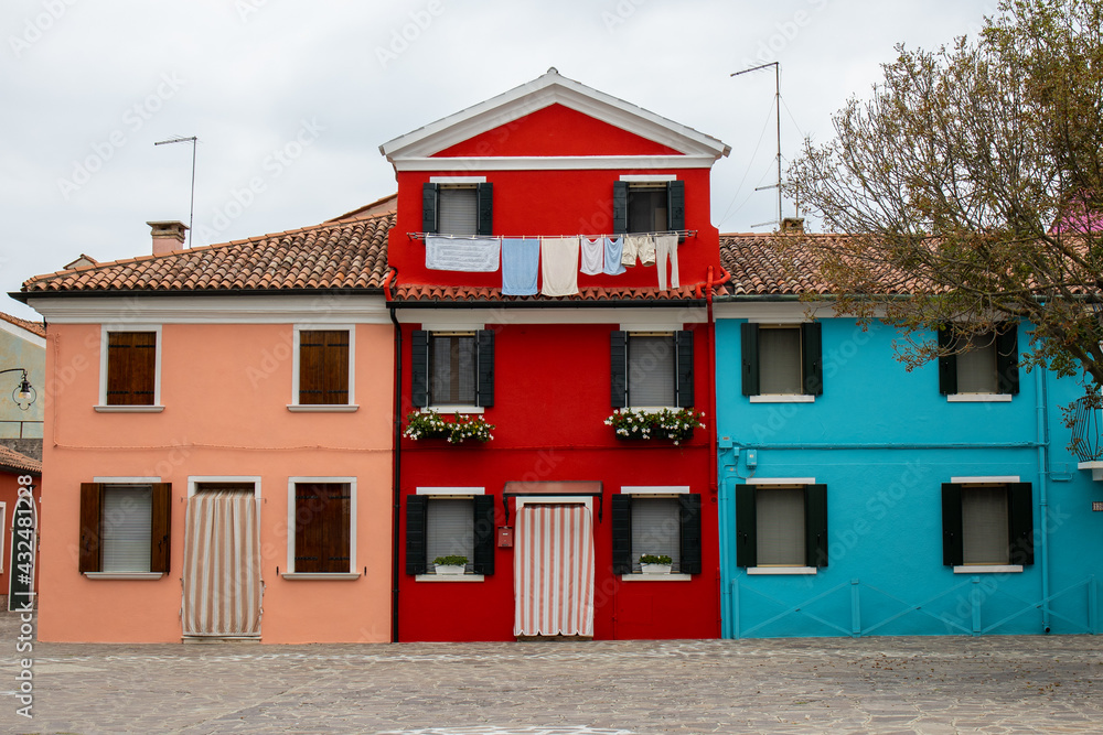 Colorful houses with brightly painted facades in Burano, Venice, Italy