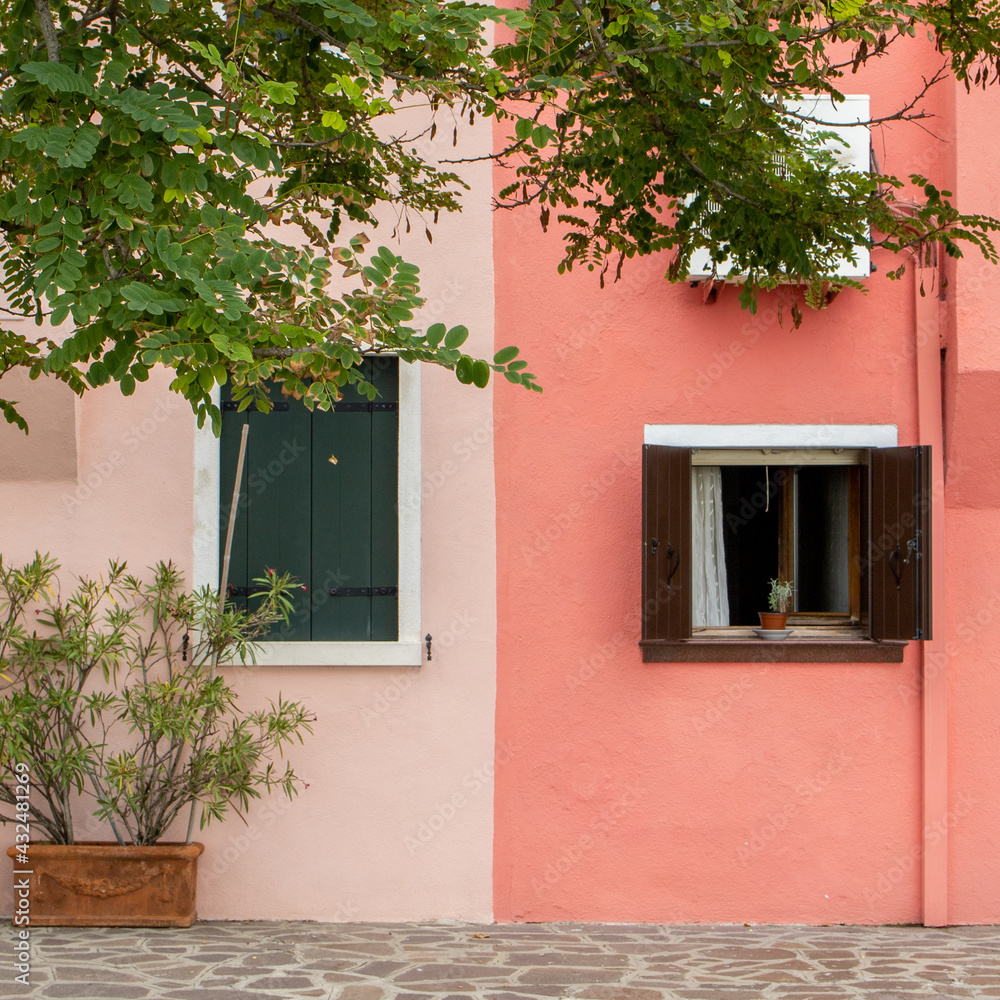Colorful houses with brightly painted facades in Burano, Venice, Italy