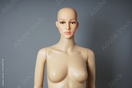 store window mannequin or display dummy with bald head and bare bust photo