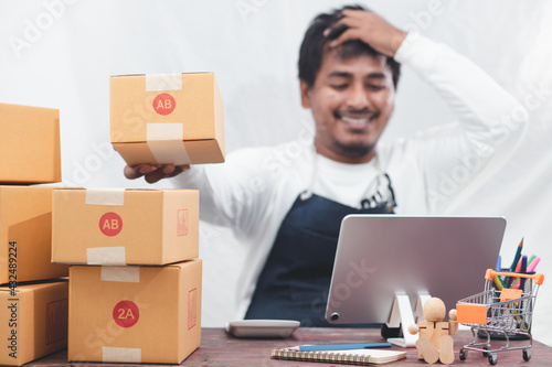 SME entrepreneurs use smartphones to contact customers Work from home to fulfill customer orders through online business websites. Parcel delivery concept  © Treecha