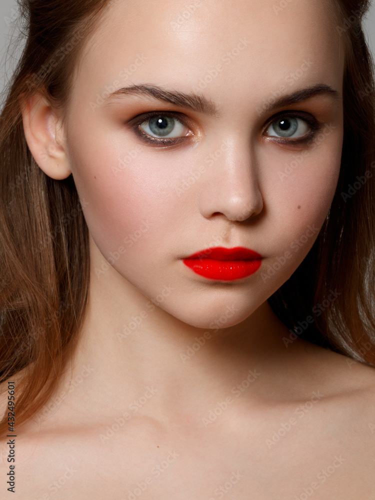 Makeup, cosmetics. Beauty young woman portrait. Beautiful model girl with beauty makeup , red lips , perfect fresh skin . Attractive lady with green eyes. Youth and Skin Care Concept Makeup, cosmetics. Beauty young woman portrait. Beautiful model girl with beauty makeup , red lips , perfect fresh skin . Attractive lady with green eyes. Youth and Skin Care Concept