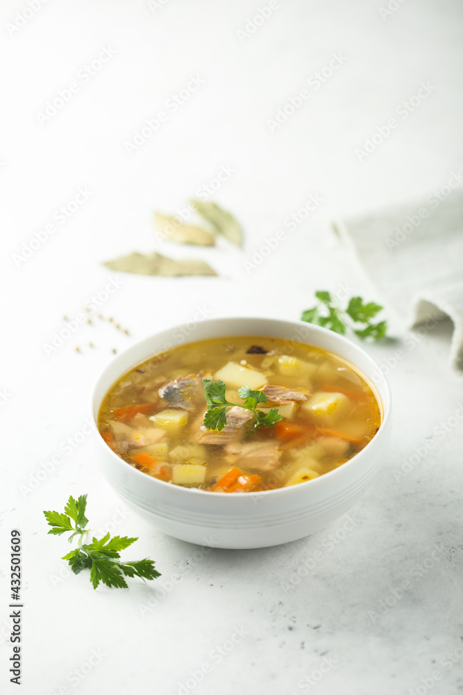 Traditional homemade salmon soup with vegetables