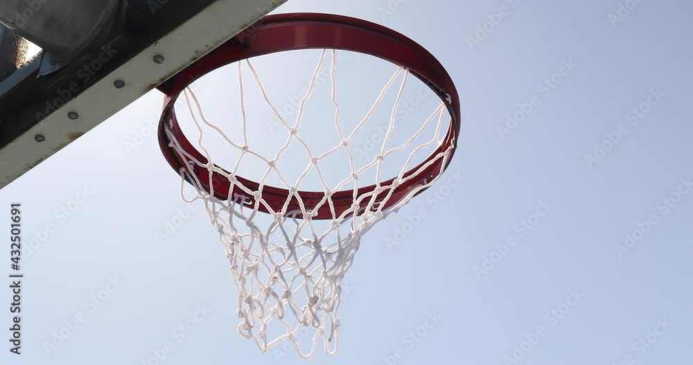 Sun flares against an outdoor basketball hoop Sun flares against an outdoor basketball hoop