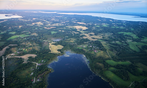 Landscape with pink sunset and lakes