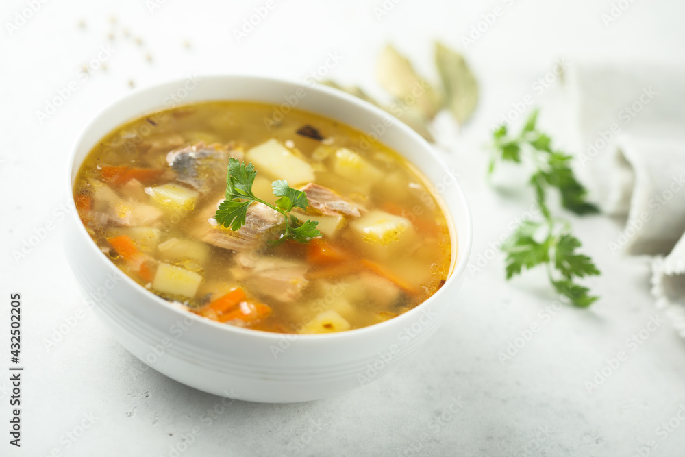 Traditional homemade salmon soup with vegetables Traditional homemade salmon soup with vegetables