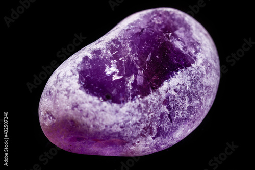Macro mineral amethyst on a black background