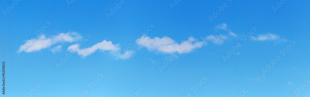 Small white clouds in the blue sky in sunny weather Small white clouds in the blue sky in sunny weather