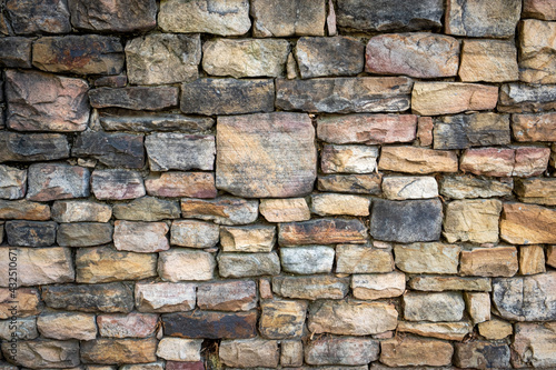 Stacked stone wall with interesting color and texture