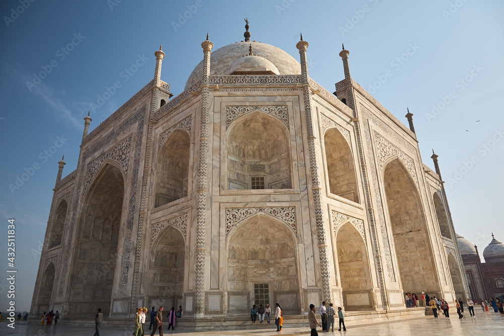 Side view of the Taj Mahal. Frog perspective. Blue sky. Love carved in marble. A dream for any sculptor or artist. Day.