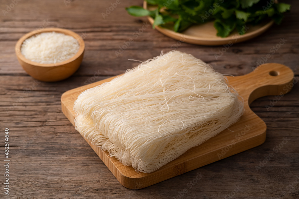 Thai died Rice Vermicelli on wood board,Uncooked Thai died Rice Vermicelli on wood board,Uncooked