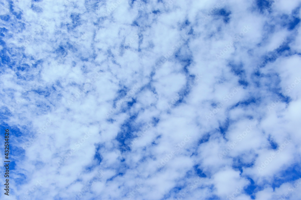 Wallpaper with cirrus and stratocumulus clouds against blue spring sky Wallpaper with cirrus and stratocumulus clouds against blue spring sky