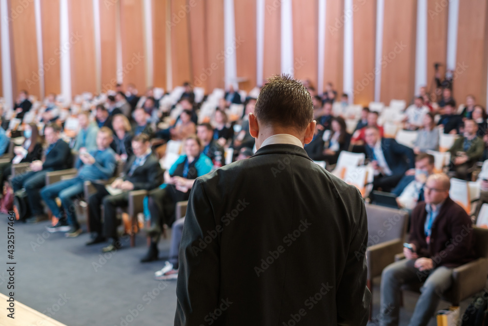 Male presenter speaks to audiences at seminar Male presenter speaks to audiences at seminar
