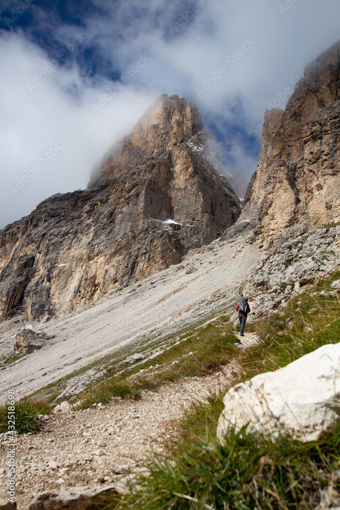 man going up the mountains, italy, dolomites